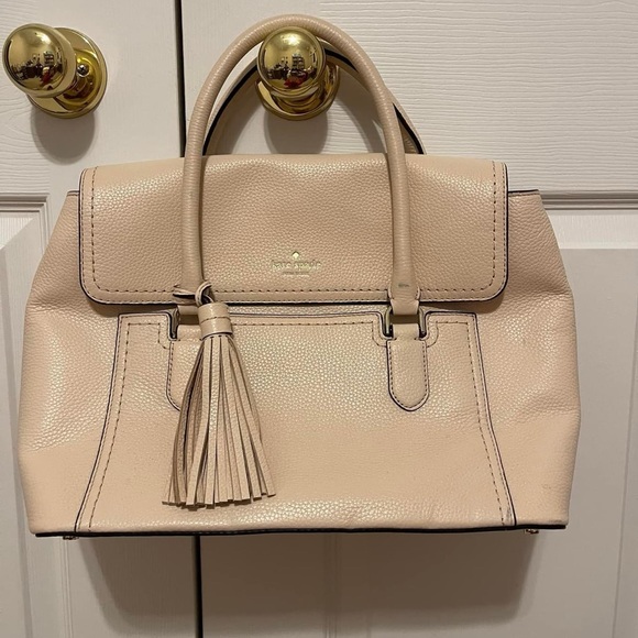 Kate Spade purse, barely used and great condition. The color is a peachy pink. - Picture 1 of 4